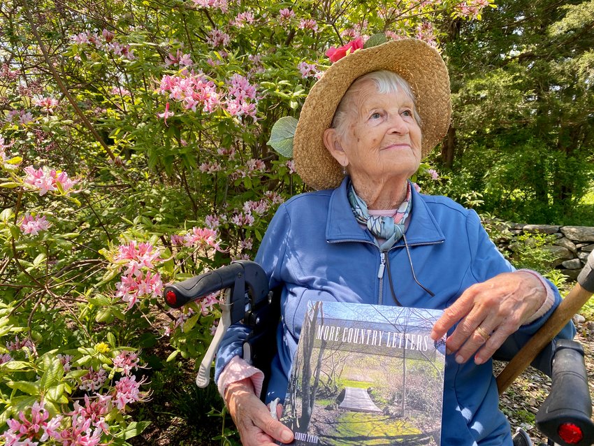 Sidney Tynan takes in the sun in her 'Back 40,' a two-acre tract of land on Tompkins Lane now well-known to the many fans of her letters and books. This photo was taken on the publication of her most previous book, &quot;More Country Letters,&quot; published in 2022.