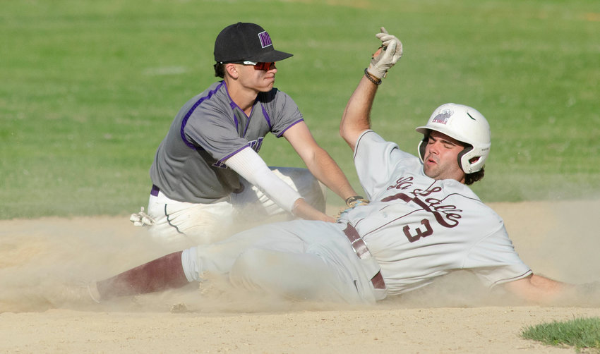 Mt. Hope second baseman Parker Camelo slaps a tag on Rams baserunner Shea Caton for the second out of the seventh inning.&nbsp;
