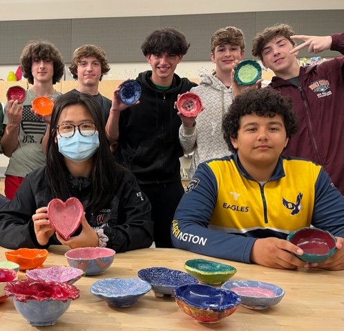 Barrington Middle School eighth-graders display their ceramic bowls, which will be available at the special BMS Empty Bowls event on Thursday, June 2.