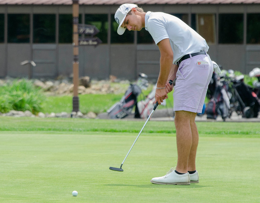 Michael Wetmore putts during his opening round in the 2022 state championship golf tournament at Cranston Country Club May 31.