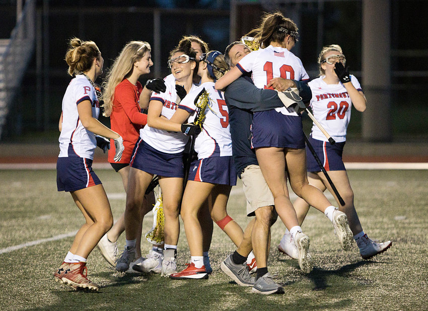 Members of the Portsmouth High School girls&rsquo; lacrosse team celebrate after storming back to beat Cranston West in the semifinals on Tuesday.