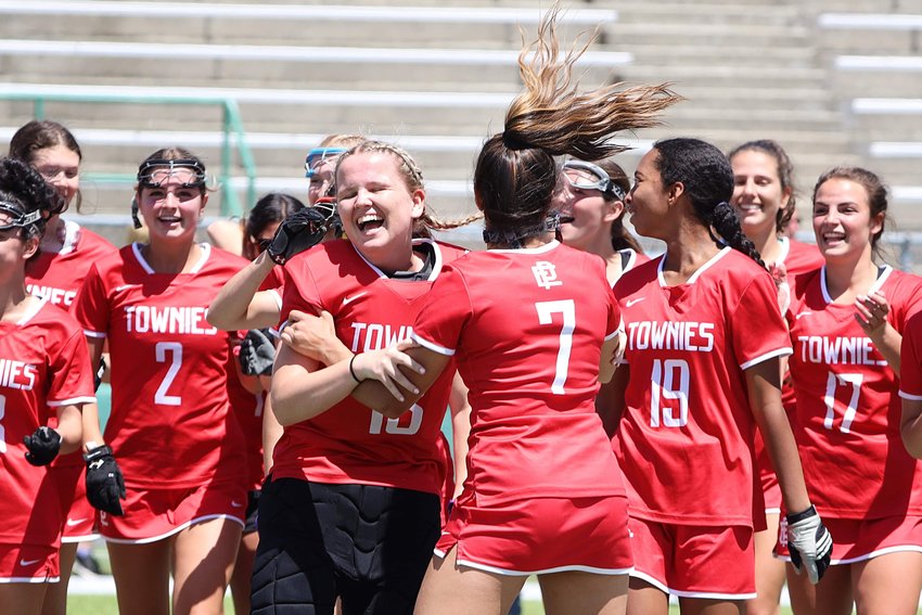 EPHS team members swarm keeper Ava Williams following the final buzzer and after her late save insured the Townies' win over North Smithfield for the Division III title Sunday, June 5.