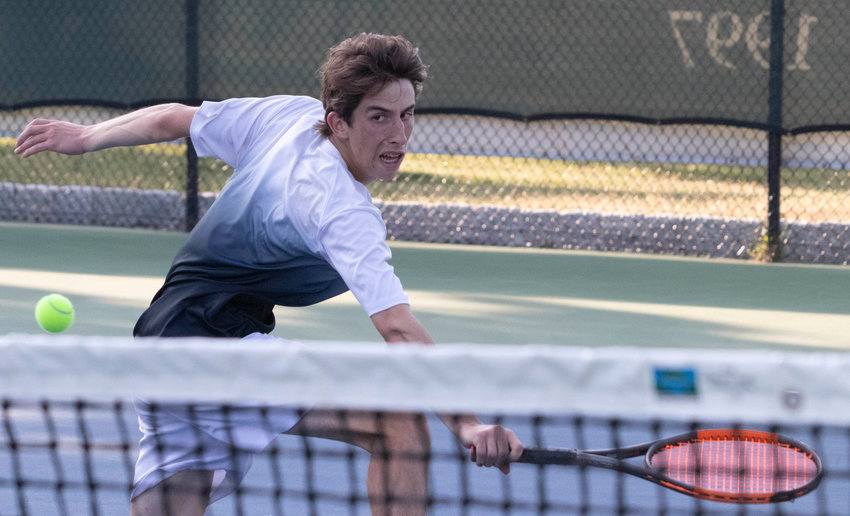 Barrington's Scott Sapolsky hits a backhand in the number one singles match.