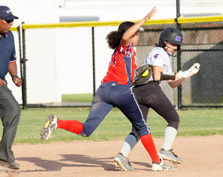 Toll Gate center fielder Sydney Perreault chases down Alice Grantham after she attempted to stretch a single into a double to lead off the sixth inning.