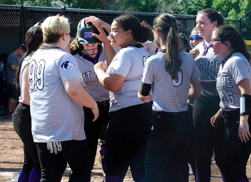 Teammates celebrate with Jayda Sylvia (middle) after she blasted a three run homer in the third inning. Mt. Hope won the game 6-0 and will play in the loser's bracket semifinal on Friday.