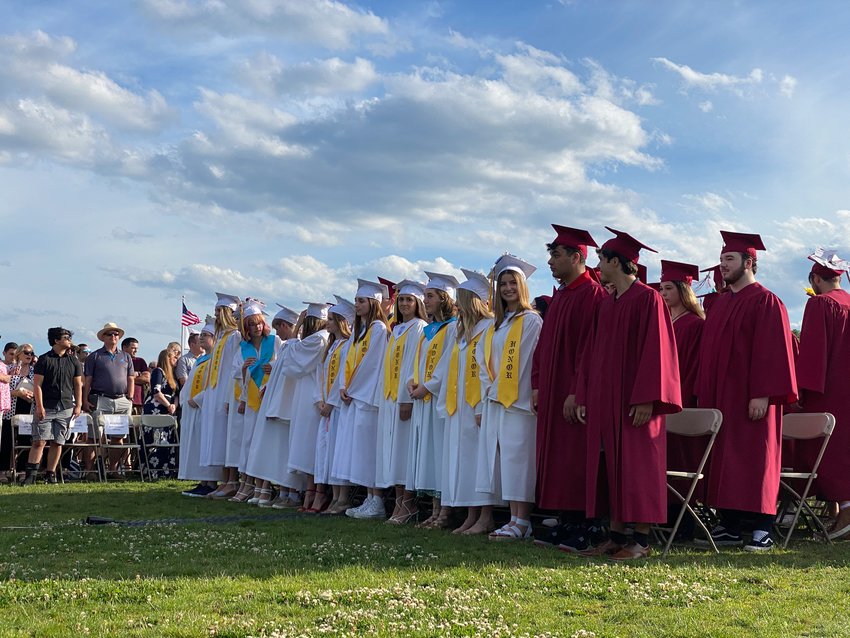 Seniors prepare to receive their diplomas at Friday evening's Tiverton High School commencement.