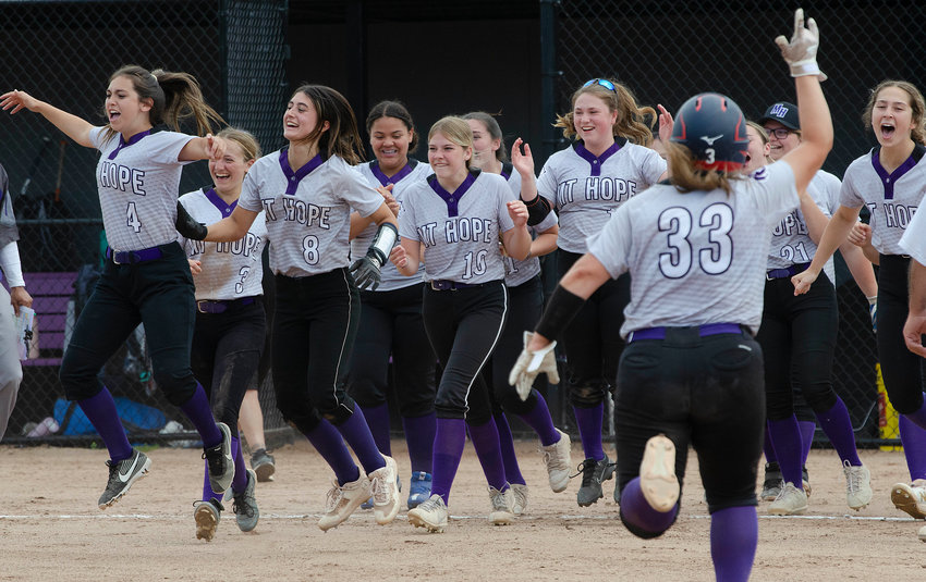 The Huskies celebrate after a thrilling 6-5 come from behind victory over Toll Gate on Saturday.
