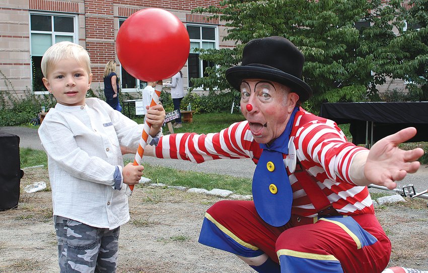 Swampscott, Ma. 10-22-17. Henry Swedenborg, left, working with Davey the Clown (David Holzman) at the 3rd annual harvest festival at Swampscott High School.
