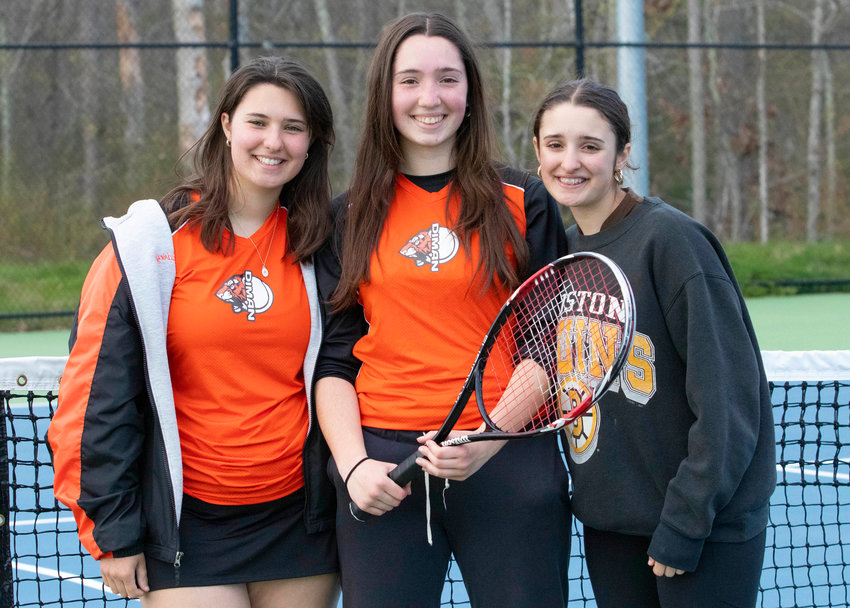 Sarah Moniz (left) and sisters Lindsey and Gloria during a match between Diman and Westport at Westport High School this spring.&nbsp;