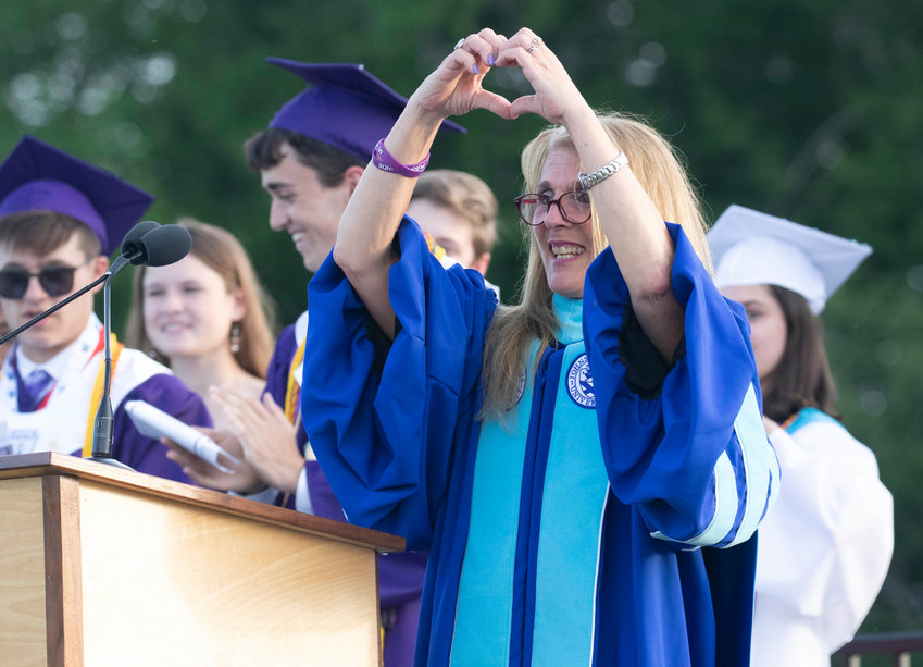 Former Mt. Hope High School Principal Deb. DiBiase shows some love during her final commencement ceremony, earlier this month.