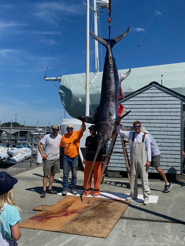Barrington's Joe Lombardi and his sons Joey and Michael reeled in a 650-pound swordfish last weekend.