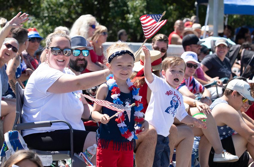 Jennifer Zachary, husband, Dave, daughter, Braelie, 7, son, Ben, 4, and their dog Kallie, cheer as the Bristol Fourth of July Parade heads down to towards the Silver Creek Bridge area of Hope Street on Monday.