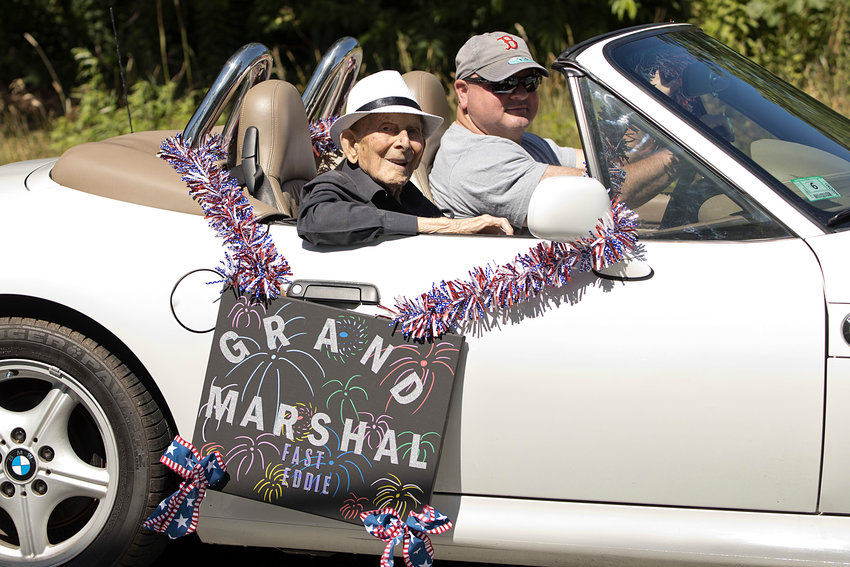 Parade grand marshal Fast Eddie Beaulieu, 106, makes his way down the parade route.