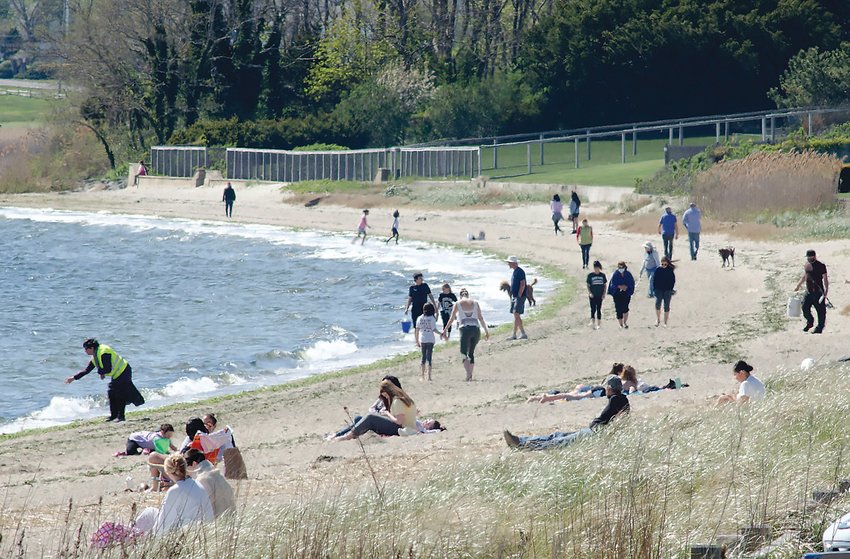 This snapshot of a Barrington shoreline shows the variety of activities that can take place on any given day between the water line and private property lines of waterfront estates &mdash; swimming, sunbathing, clamming, walking, etc. Advocates want to clearly establish in Rhode Island law that these rights extend from the high tide line to another six feet landward along all coastal shorelines.