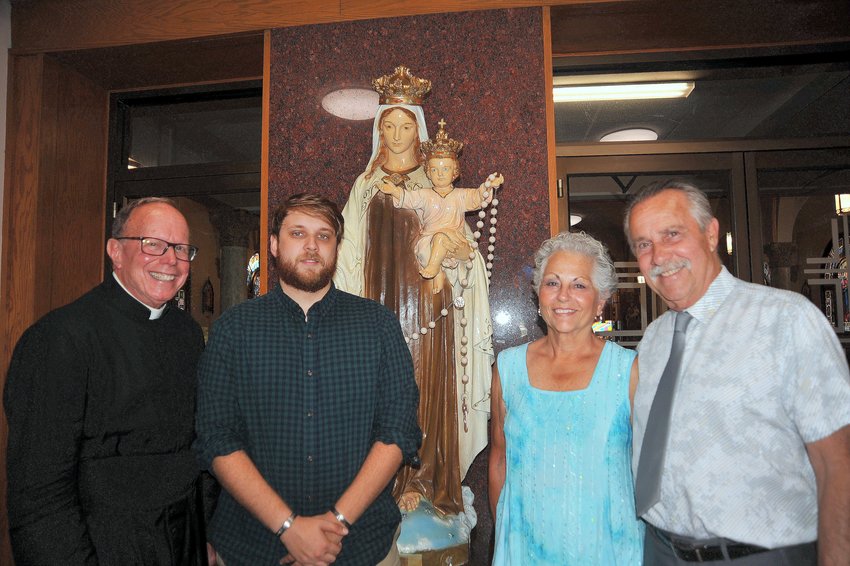 The Our Lady of Mt. Carmel Church Feast this year will be led by left-right Father Henry P. Zinno, Jr., pastor; Colt S. Dean, Thomas Vendituoli &quot;Faith In Action&quot; Award winner; and Chief Marshals Donna and Ollie Poissant.