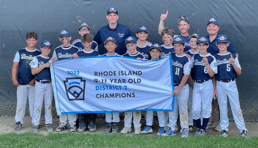 Members of the 11U All-Star baseball team display the District 2 Championship banner after defeating Pawtucket in the finals. Barrington was scheduled to play its first game in the state tournament on Monday night.