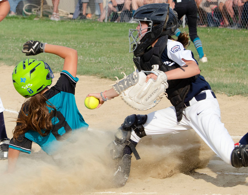Barrington&rsquo;s Angie Promades tries to tag out a Cranston Western runner at the plate.