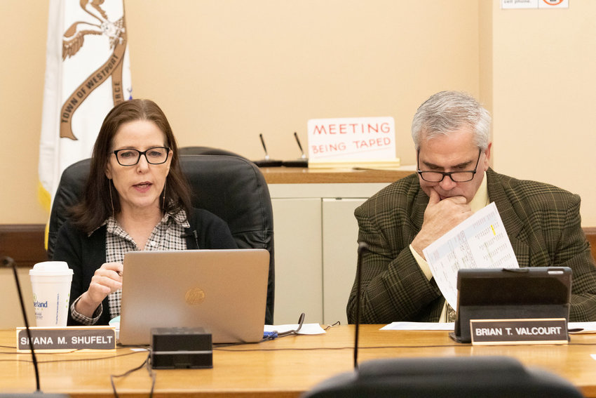 Select board chairwoman Shana Shufelt and board member Brian Valcourt discuss a possible budget override at a board meeting in March.