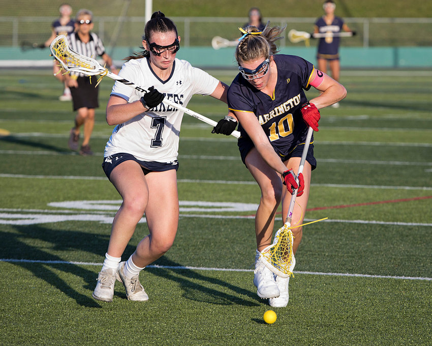 Barrington High School&rsquo;s Kate Robertson (right), shown during the state championship game against Moses Brown, was recently named RI Girls Lacrosse Player of the Year.