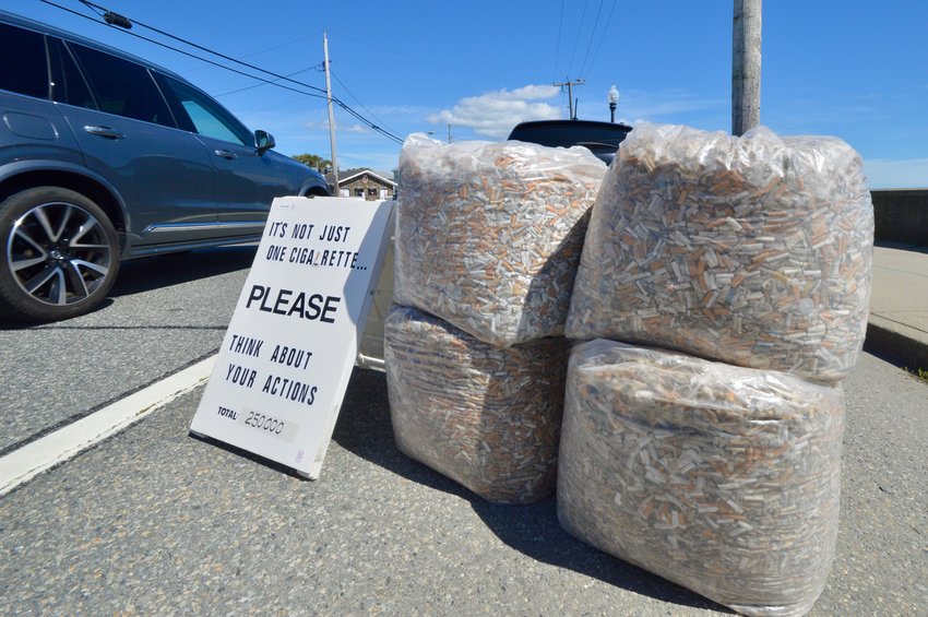 Randy Matsch&rsquo;s display of 250,000 cigarette butts greets drivers and pedestrians on Park Avenue in Portsmouth Saturday.