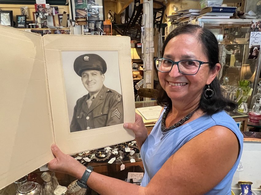 Freda Lehrer with a photo of her uncle Harry Molasky, who served in WWII and ran Molasky&rsquo;s, the family&rsquo;s dry goods store at 44 State St. When Lehrer put the house on the market and opened the long-dormant safe, Harry&rsquo;s WWII records were among the treasures it contained.
