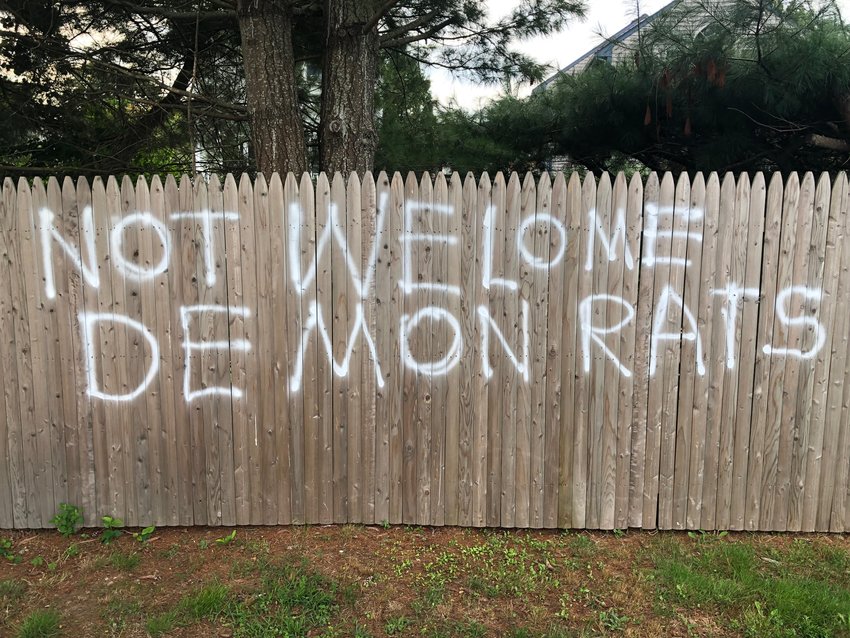 An example of the graffiti that appeared on a fence outside the CFP Arts, Wellness, and Community Center on Sunday, just hours before the Portsmouth Democratic Town Committee&rsquo;s annual fund-raiser there.