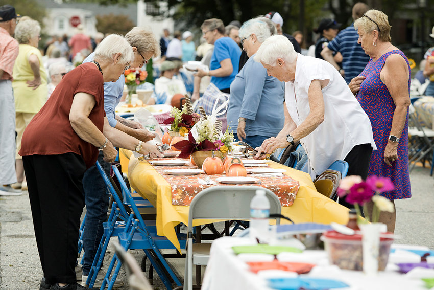 Guests decorate their tables as they arrive at Little Compton's annual &quot;Community Dinner,&quot; Sunday afternoon.&nbsp;