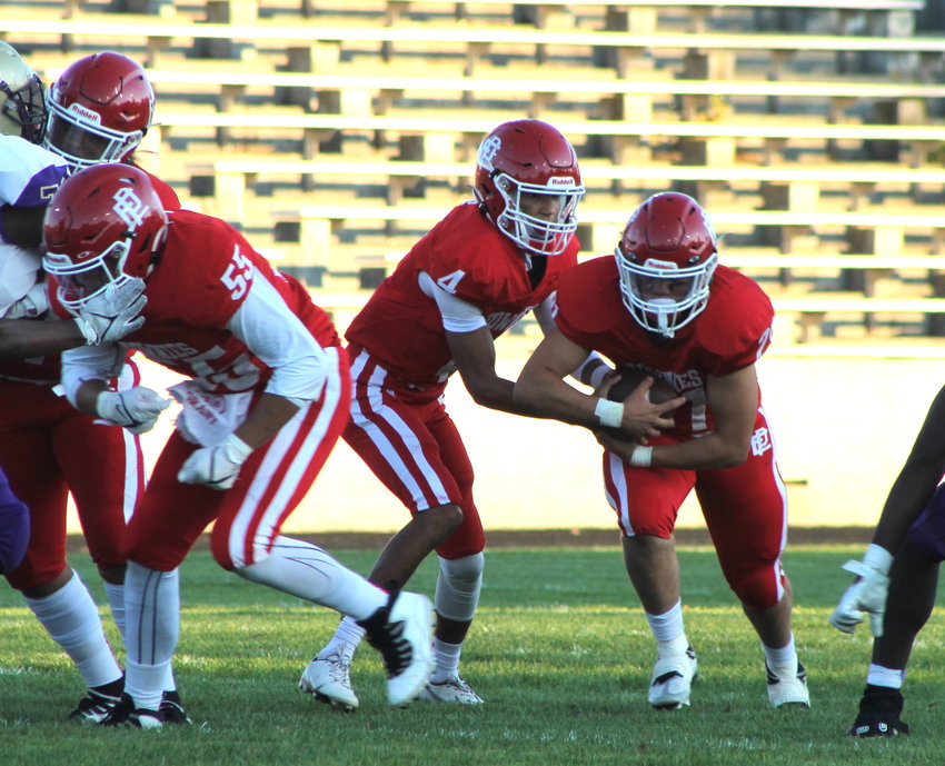 Steven Clark takes a handoff from Max Whiting for the EPHS football team in its Division II opener against St. Raphael, September 15. Clark scored three times for the Townies in their 29-22 win.