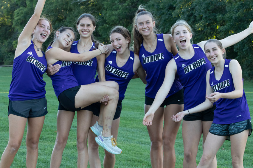The Huskies girls cross country team from left, Analucia Romero, Ryan Coffey, Jessica Deal, Sonia Bradley, Reyn Ferris, Lily Dasilveira, and Lucy O&rsquo;Brien, posted their best regular season record ever at 8-3, according to coach Susan Rancourt. The team is waiting their fate about qualifying for states as a team.