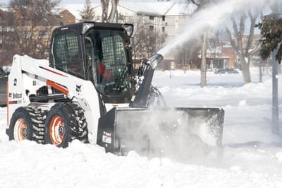 A &quot;Bobcat&quot; plowing a sidewalk with its snowblower attachment similar to the vehicles the East Providence DPW is requesting to purchase as part of the Fiscal Year 2022-23 Capital Budget.