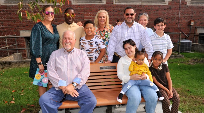 Former Barrington Probate Judge Marvin Homonoff (pictured left) sits on the &quot;Judge's Bench&quot; surrounded by his family.