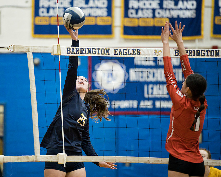 Kasey Dillon spikes the ball over the net while rallying with East Providence, Thursday.