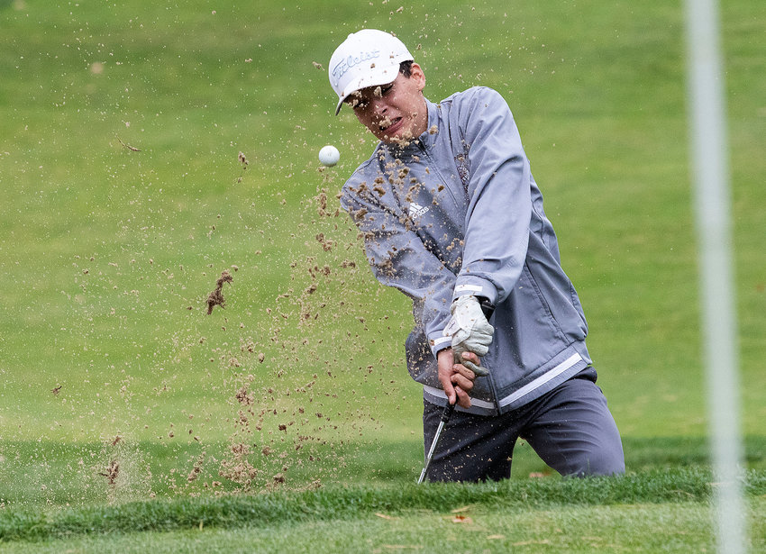 Owen Boudria hits out of a massive bunker that protects the 18th green at Acushnet River Valley Country Club during the MAC Tournament on Thursday. Boudria got up and down for a bogie and shot a 92. The Wildcats placed seventh out of thirteen teams and play at the state sectionals on Monday in Foxboro.