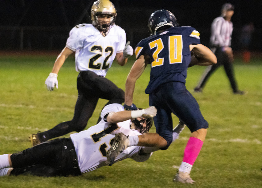Barrington&rsquo;s AJ DiOrio stiff-arms a North Kingstown defender during a first-half run on Friday night.