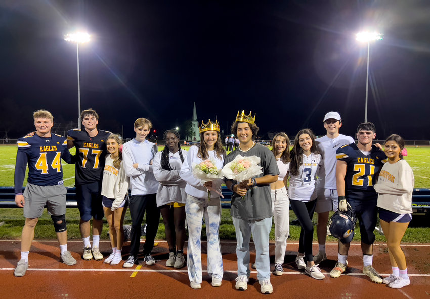 Helena DeFanti and Robbie Pippitt (wearing crowns) are named this year's Golden Eagles during the homecoming ceremony at halftime.