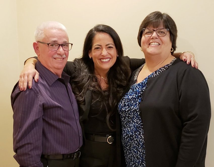 This year's Bristol Sports Club &quot;Woman of the Year&quot; Jennifer Oliveira Mancieri (center) is pictured with her parents, Edguardo and Rosemary Oliveira. Mancieri will be honored at a banquet on Nov. 5th at the Bristol Sports Club.