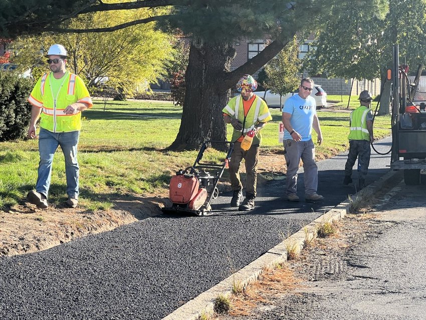East Providence recently used city money to repair sidewalks, in asphalt rather than cement, along the state-owned Pawtucket Avenue. A bill passed in the Rhode Island Senate would call for the state to pick up the expense