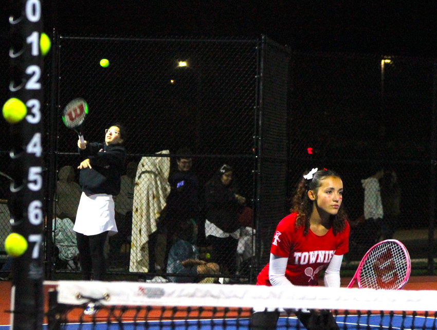 East Providence's Emma Gillheeney serves with partner Tianna Brierly at net during their victory at third singles, which clinched the overall match win for the Townies in their Division III girls' tennis semifinal contest with Scituate Thursday night, Nov. 3.