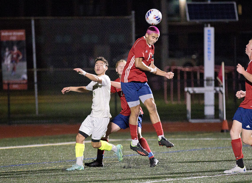 Portsmouth High&rsquo;s Jackson Fox cuts Bishop Hendricken's 2-0 lead in half with a header into the goal in the second half of Thursday's Division I quarterfinal match.