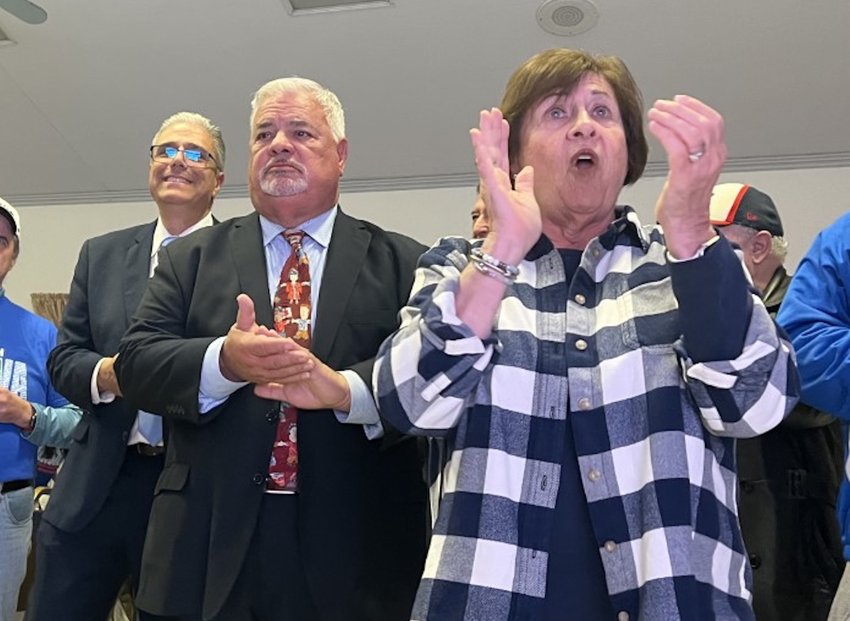 Mayor Bob DaSilva, At-Large councilor Bob Rodericks and Stephanie Vinhateiro cheer as the last of the 2022 election results come in Tuesday night, Nov. 8.