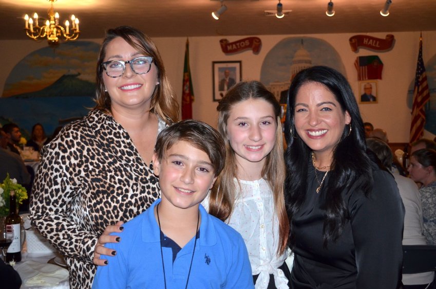 Bristol Sports Club &quot;Woman of the Year&quot; Jennifer Mancieri (right) was so delighted to see this family (left-right: Mariel Stone, Jack Duarte, and Josephine Duarte) at her banquet Saturday night. Jennifer helped them find a new place to live after a fire destroyed their Hope St. home in June of 2021. It's situations like this which has earned Jennifer high praise throughout the community.