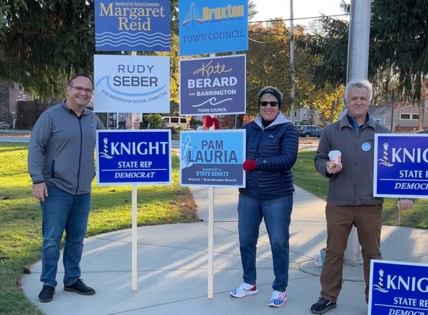Rep. Jason Knight (right) stands with Rudy Seber (left) and Cynthia Coyne outside a voting location on Tuesday, Nov. 8. Rep. Knight defeated Republican challenger Scott Fuller.