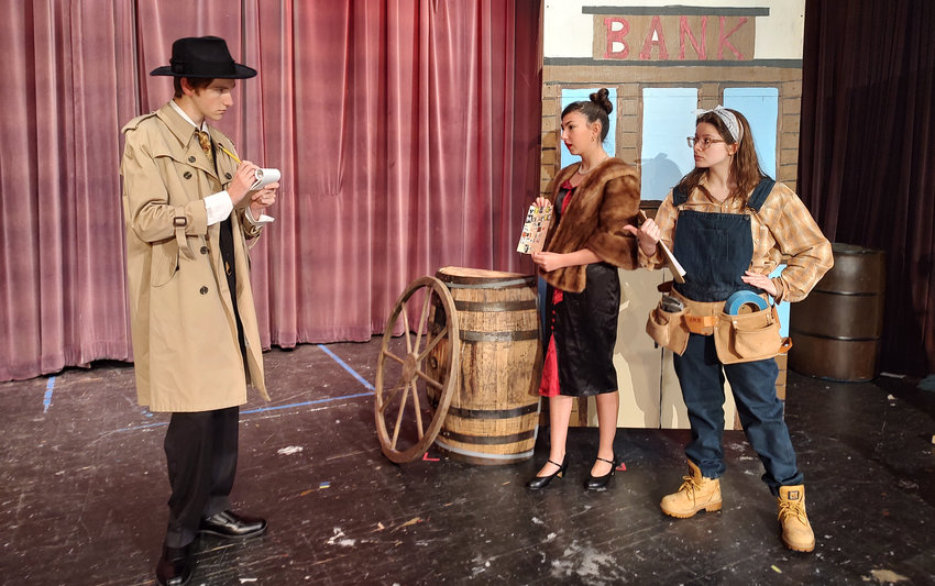 Max Bleakney (left) as Lt. Frank Cioffi questions &quot;producer&quot; Carmen Bernstein (center), played by Zoe Gerstenblatt and &quot;stage hand&quot; Joanie Harmon, played by Ari Uriati.