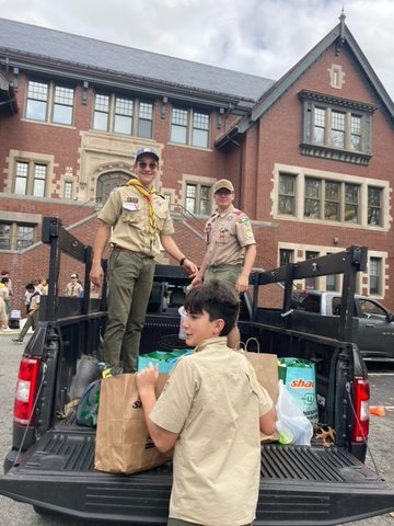 Scouts unload truckloads of food gathered during the 34th annual Scouting for Food Drive in Barrington.