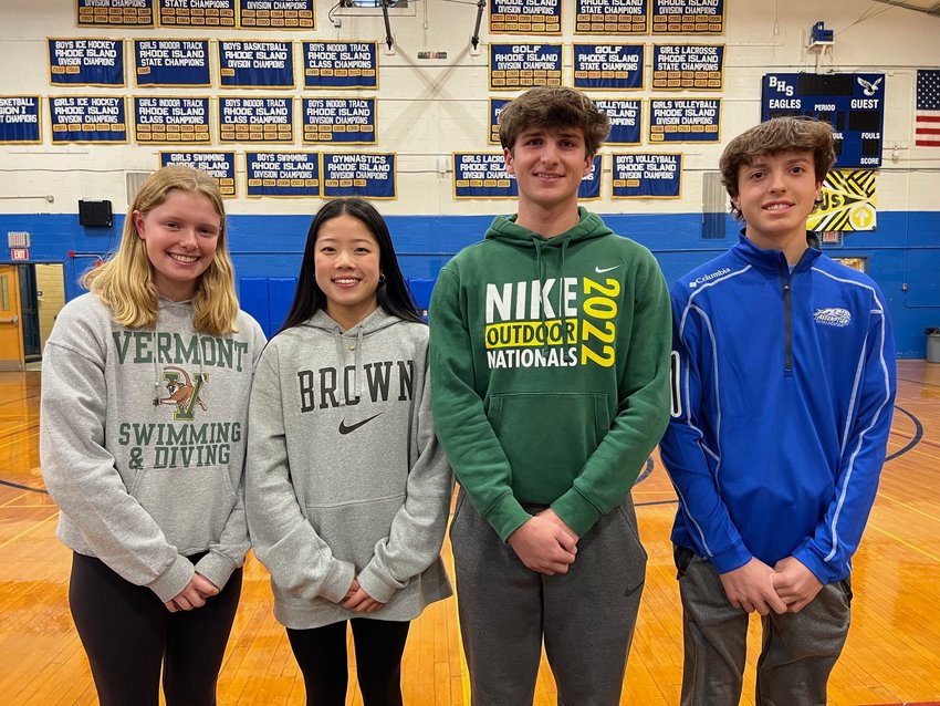 Barrington High School senior student-athletes (from left to right) Zoe Webster, Emily Ford, Nathan Greenberg and Cole Vieira pose for a photo before signing their National Letters of Intent during a special ceremony in the high school gym.