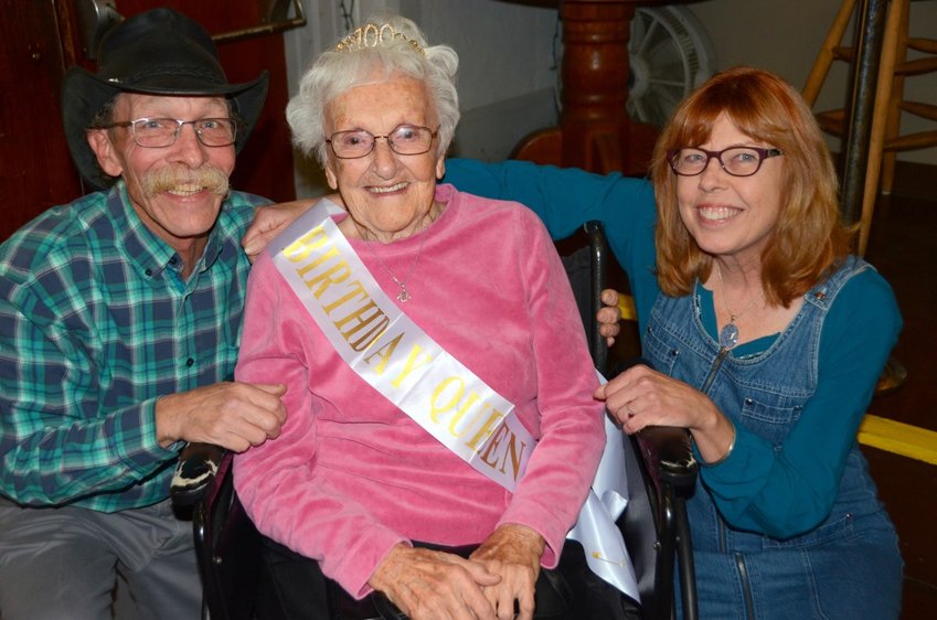 Sophie Salamon was the center of attention Sunday at her 100th birthday celebration. Here, she's seen with nephew, Michael Salamon, and Linder Johnson.