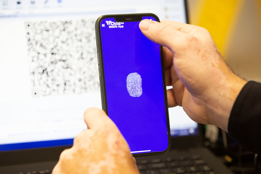 Once a digital fingerprint is captured using analysis software that ensures a complete and accurate print, it can be displayed on the smartphone of the parent or guardian account holder, as demonstrated here by Sgt. Mourato.