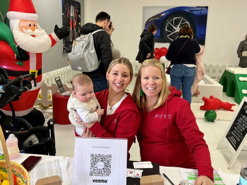 Laurel Polselli and Kateri Buerman, founders of Four Hearts Foundation, at the &ldquo;Santa Claus for a Cause&rdquo; fund-raiser on Sunday to benefit the Foundation&rsquo;s effort to rebuild the Portsmouth Community Playground.