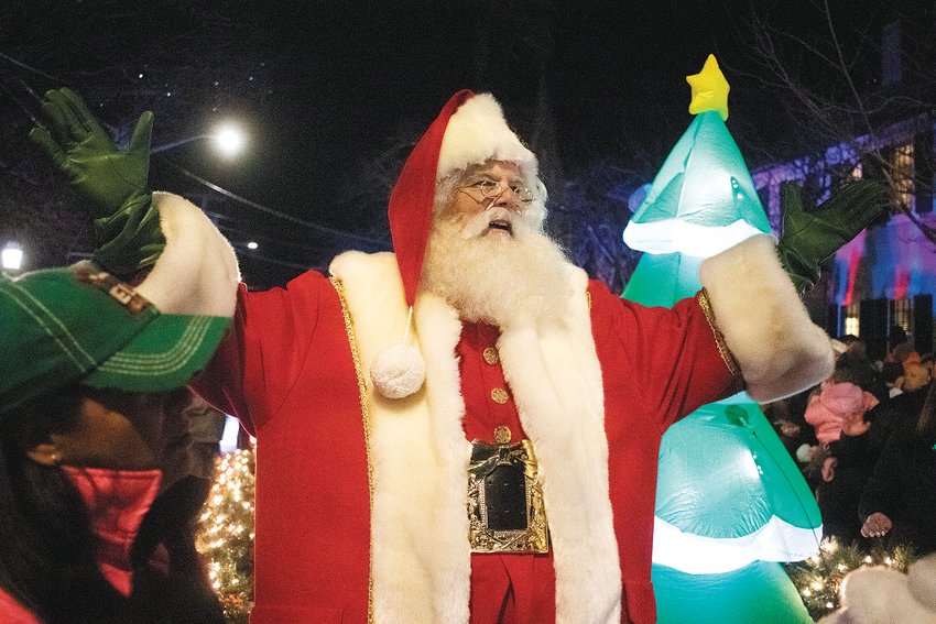 Santa Claus, played by Michael Rielly, arrives to greet the crowds at Bristol&rsquo;s Grand Illumination Sunday night. Rielly led the town&rsquo;s Christmas Festival in recent years, before handing the reins to new leadership this year. He and his James D. Rielly Foundation are organizing a new Santa House that is open to visitors throughout the month of December in downtown Bristol.