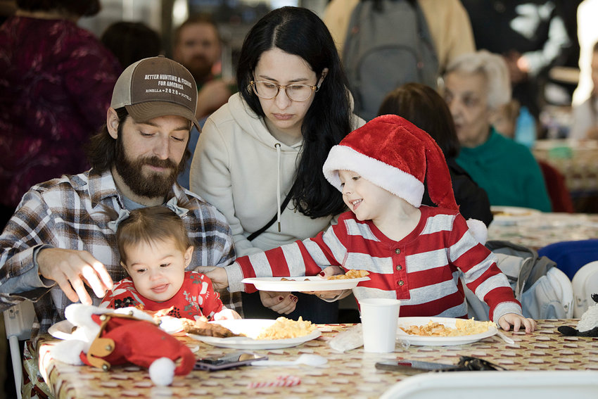 Jonathan, Maeve, Sally, and Liam Borges enjoy breakfast together during Central Fire Company's &quot;Breakfast with Santa&quot; event in 2022.